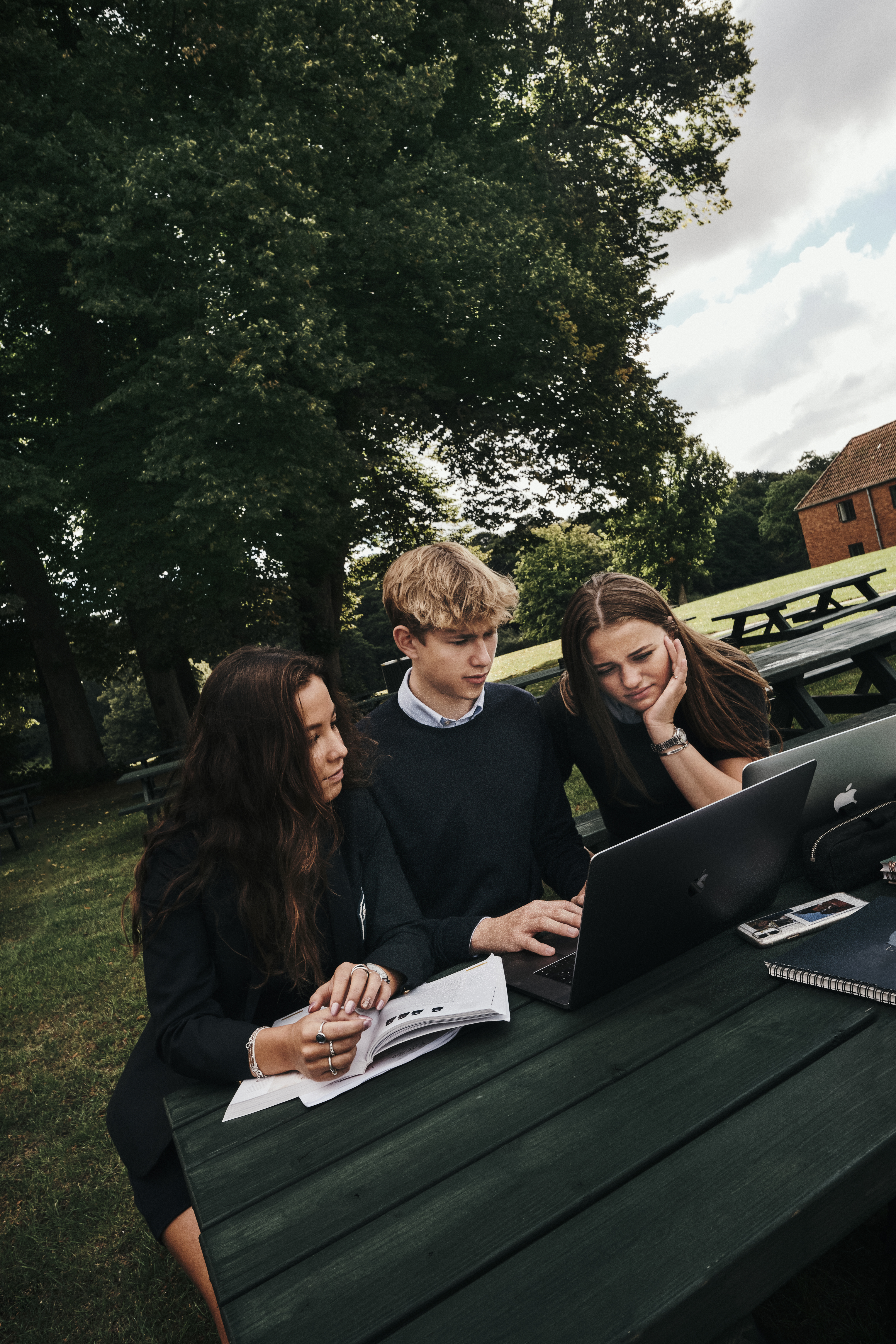 Students from Herlufsholm with their computer, studying outside